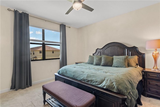 10008 W Villa Cir Unit 10008, Vero Beach, FL 32966 - bedroom featuring baseboards, light carpet, and ceiling fan