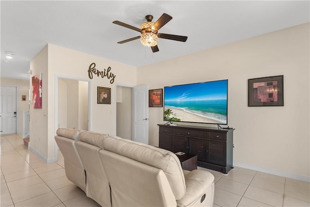 10008 W Villa Cir Unit 10008, Vero Beach, FL 32966 - living room with light tile patterned floors, baseboards, and a ceiling fan