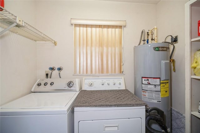6001 Palm Dr, Fort Pierce, FL 34982 - laundry area with water heater and washing machine and clothes dryer