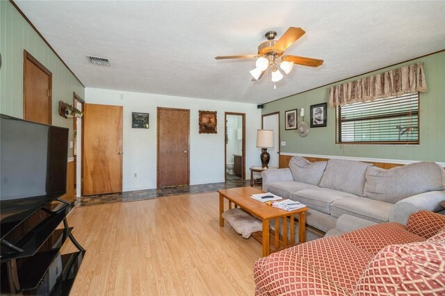 6001 Palm Dr, Fort Pierce, FL 34982 - living room featuring wood finished floors and a ceiling fan