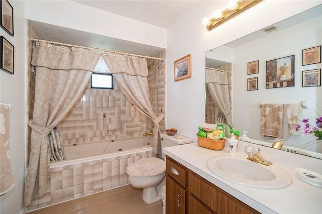 6001 Palm Dr, Fort Pierce, FL 34982 - bathroom with toilet, vanity, tile patterned flooring, and tiled shower / bath combo