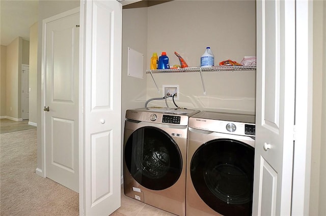 3951 Playa Del Sol Dr Unit 201, Rockledge, FL 32955 - laundry area with baseboards, laundry area, independent washer and dryer, and light colored carpet