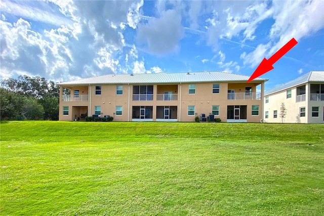 3951 Playa Del Sol Dr Unit 201, Rockledge, FL 32955 - view of building exterior with central air condition unit