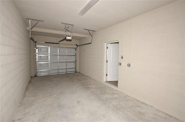 3951 Playa Del Sol Dr Unit 201, Rockledge, FL 32955 - garage with concrete block wall and a garage door opener