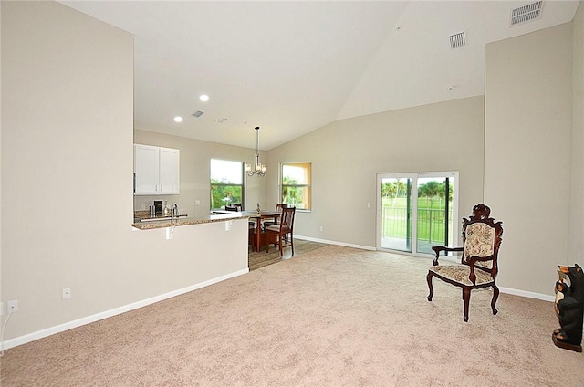 3951 Playa Del Sol Dr Unit 201, Rockledge, FL 32955 - sitting room featuring baseboards, light carpet, and visible vents