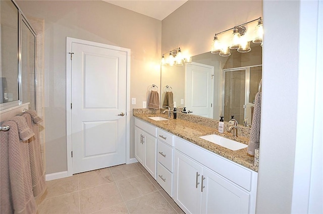 3951 Playa Del Sol Dr Unit 201, Rockledge, FL 32955 - bathroom with double vanity, baseboards, a shower stall, and a sink