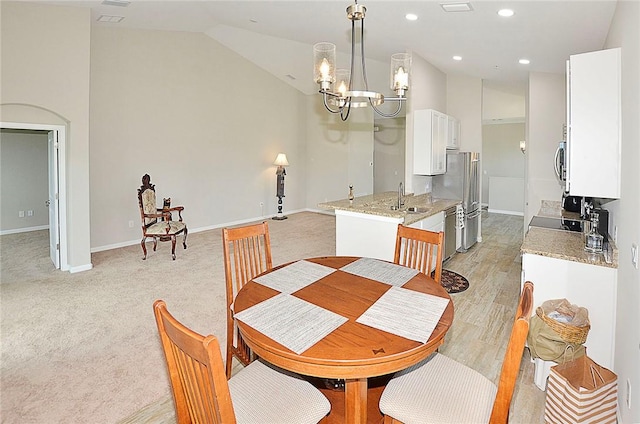 3951 Playa Del Sol Dr Unit 201, Rockledge, FL 32955 - dining space featuring an inviting chandelier, baseboards, vaulted ceiling, and recessed lighting