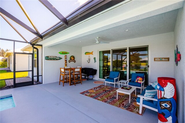 sunroom / solarium featuring ceiling fan