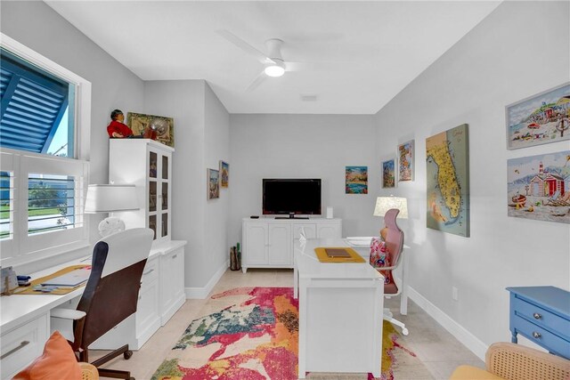 office featuring ceiling fan and light tile patterned flooring