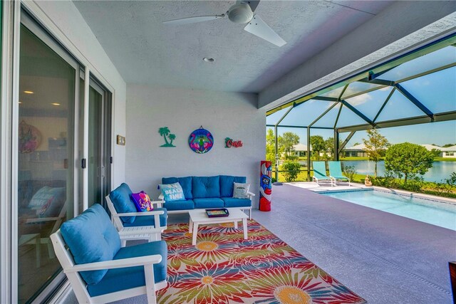 view of patio / terrace featuring an outdoor hangout area, a water view, glass enclosure, and ceiling fan