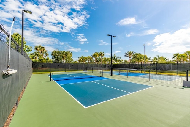 view of sport court with fence