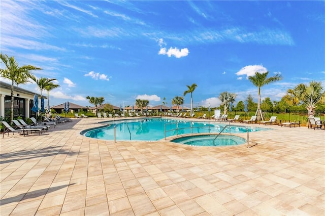 pool featuring a patio and fence