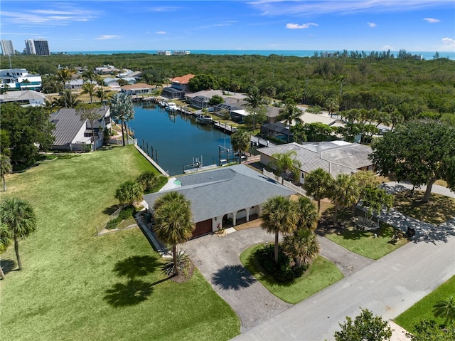 birds eye view of property featuring a water view