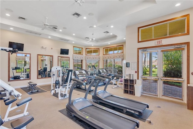 6341 Astor Pl, Vero Beach, FL 32966 - exercise room featuring ceiling fan, carpet floors, recessed lighting, a raised ceiling, and french doors