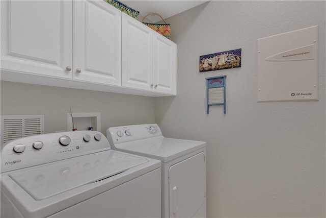 6341 Astor Pl, Vero Beach, FL 32966 - laundry area with cabinet space and separate washer and dryer
