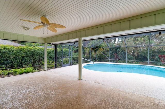 view of pool with a lanai, a patio, and ceiling fan