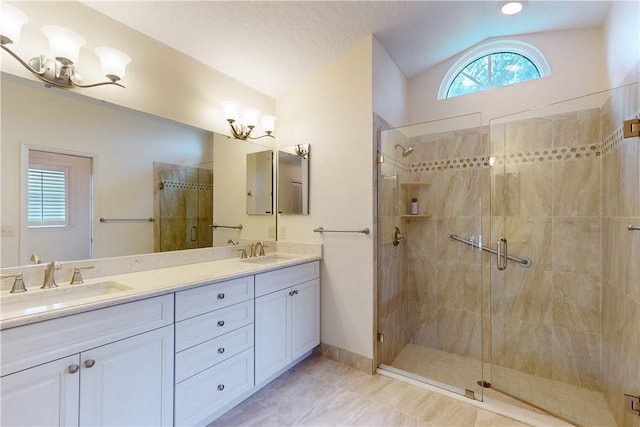 bathroom with walk in shower, lofted ceiling, and plenty of natural light