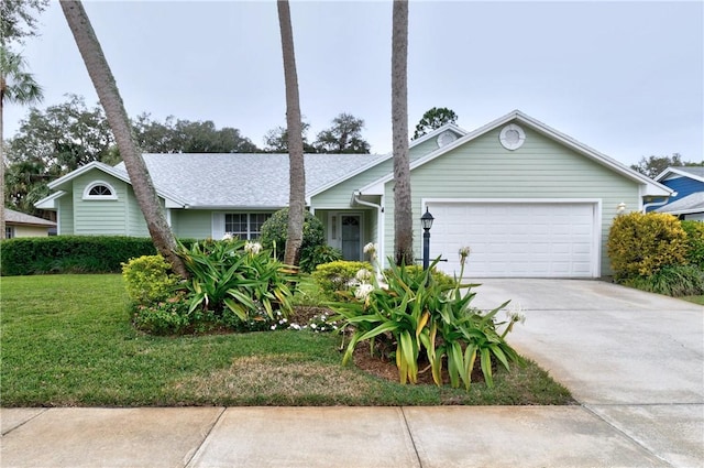 ranch-style home featuring a garage and a front lawn