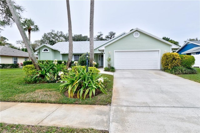 ranch-style home with a garage and a front yard