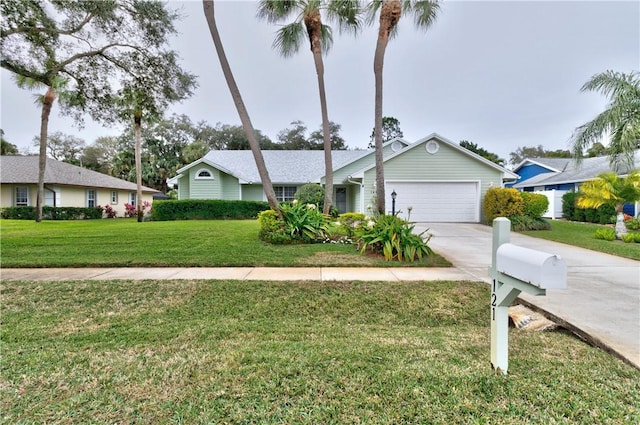 single story home with a garage and a front yard