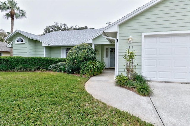 single story home with a garage and a front yard