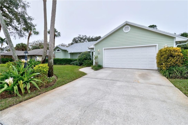 ranch-style home with a garage and a front yard