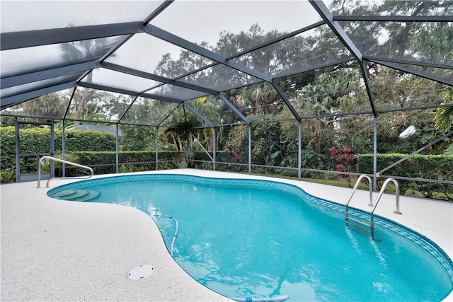 view of pool featuring a lanai and a patio area