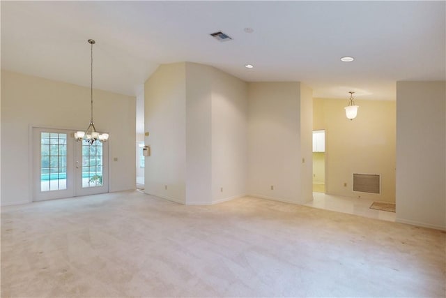 carpeted spare room featuring lofted ceiling