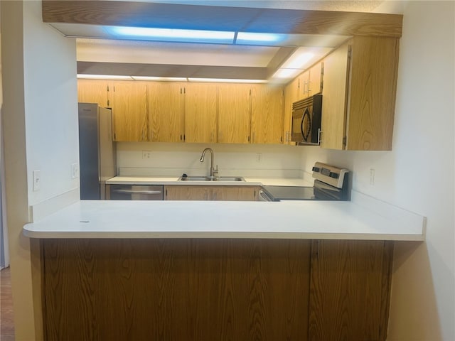 kitchen with appliances with stainless steel finishes and sink