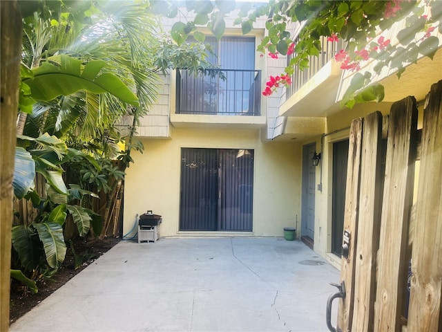 view of patio featuring a balcony