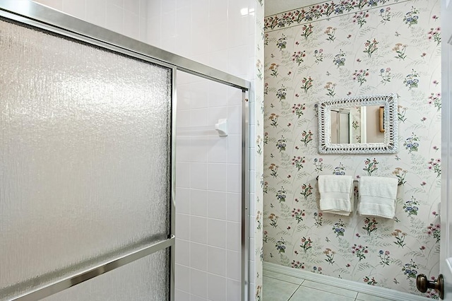 bathroom with tile patterned floors and walk in shower