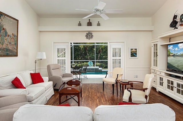 living room featuring dark hardwood / wood-style floors, a healthy amount of sunlight, and ceiling fan