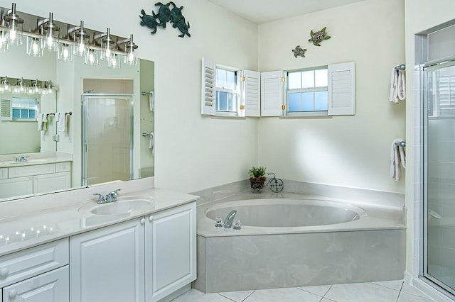 bathroom featuring shower with separate bathtub, tile patterned floors, and a wealth of natural light