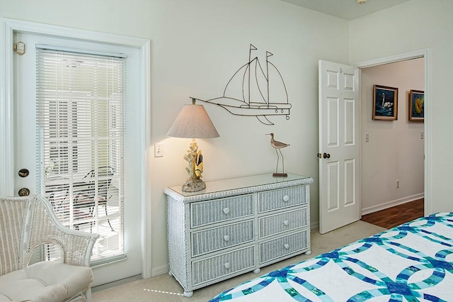 carpeted bedroom with multiple windows