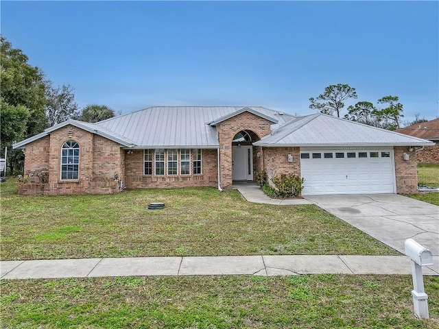 single story home featuring a garage and a front yard