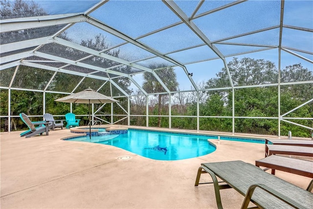 view of pool with a lanai, a patio, and an in ground hot tub