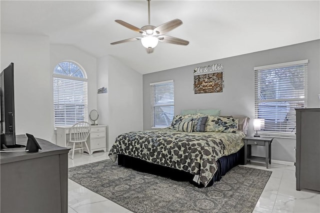 bedroom featuring lofted ceiling and ceiling fan