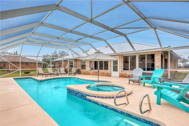 view of pool featuring an in ground hot tub, a lanai, and a patio area