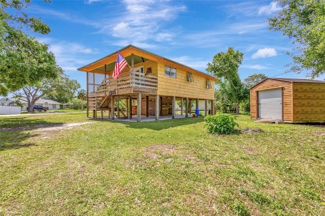 1805 15th St SW, Vero Beach, FL 32962 - rear view of property featuring a yard, a storage shed, an outbuilding, and stairway