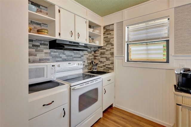 1805 15th St SW, Vero Beach, FL 32962 - kitchen with open shelves, light wood-type flooring, white appliances, under cabinet range hood, and tasteful backsplash