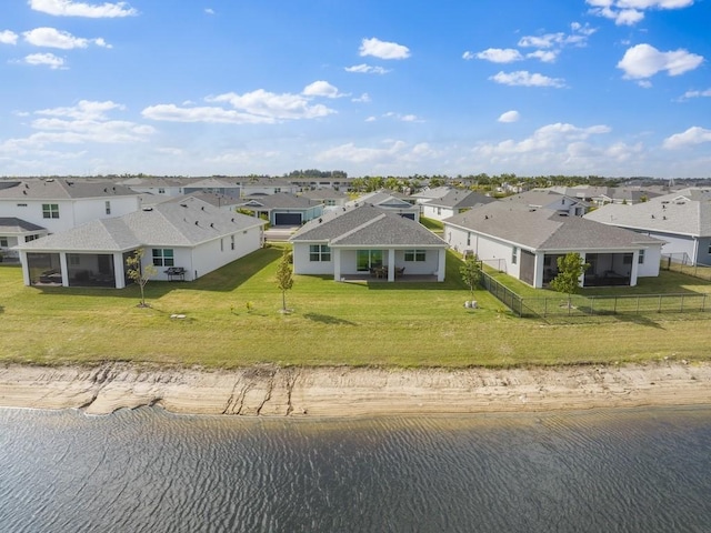 bird's eye view featuring a residential view and a water view