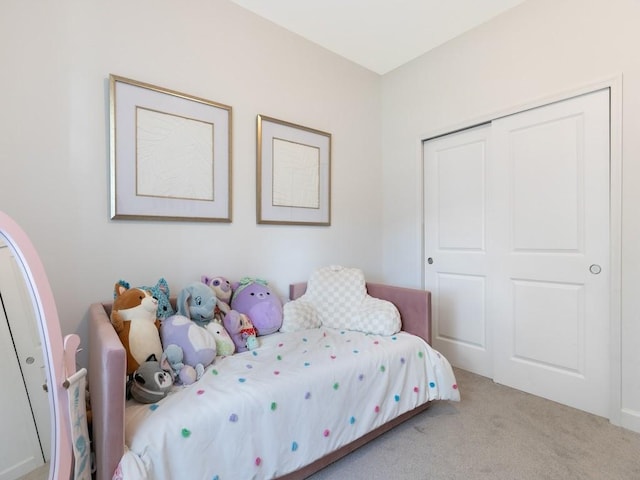 carpeted bedroom with a closet