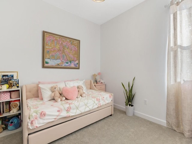 bedroom featuring carpet flooring and baseboards