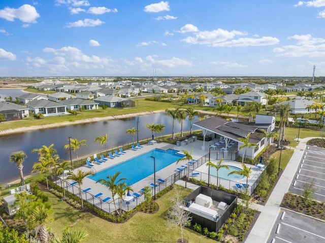 birds eye view of property featuring a residential view and a water view