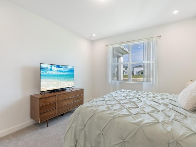 bedroom with recessed lighting, baseboards, and light colored carpet