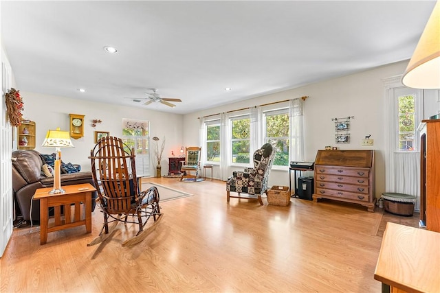 sitting room featuring ceiling fan and light wood-type flooring