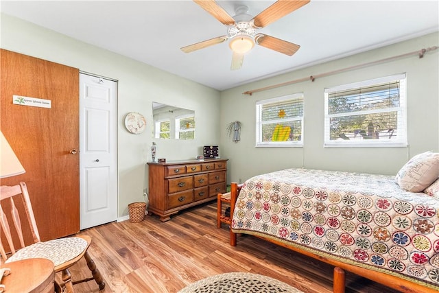 bedroom featuring hardwood / wood-style floors and ceiling fan