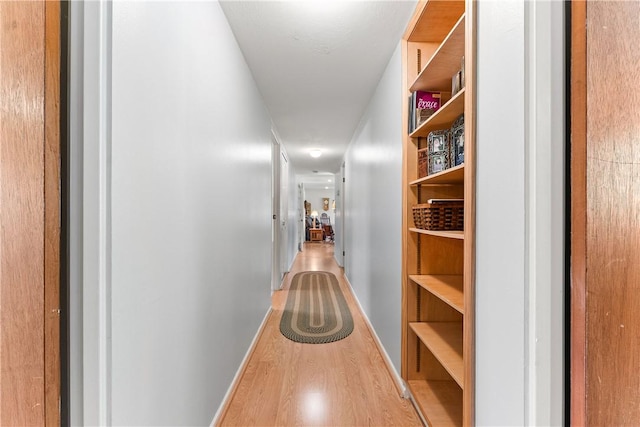 corridor featuring hardwood / wood-style flooring