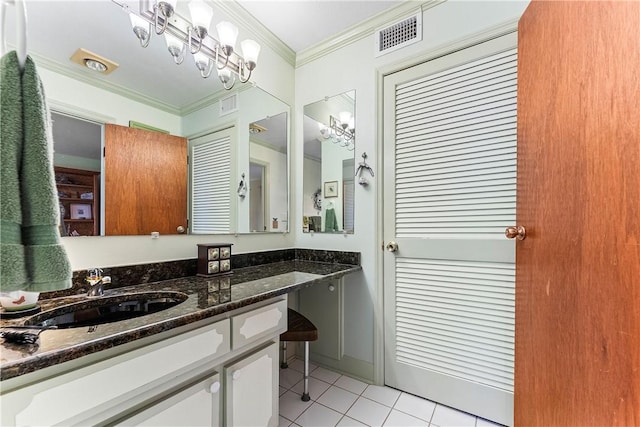 bathroom featuring tile patterned floors, vanity, and ornamental molding