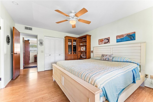 bedroom featuring ceiling fan and light hardwood / wood-style floors